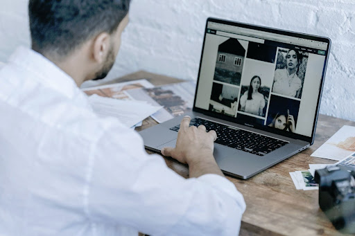 A guy editing photos on his mac.